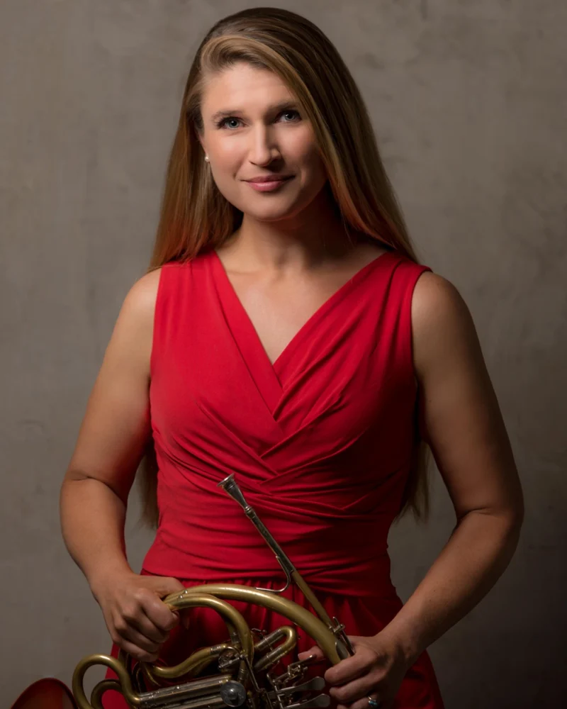 Dr. Angela K. Winter holding her horn